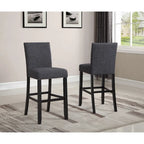 Table à manger de style moderne avec table de bar ronde et 2 chaises de bar cloutées