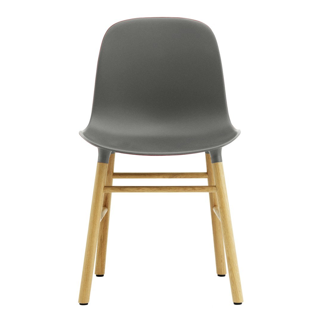 Chaise de salle à manger contemporaine en plastique moulé et chêne avec système d'assemblage intégré.