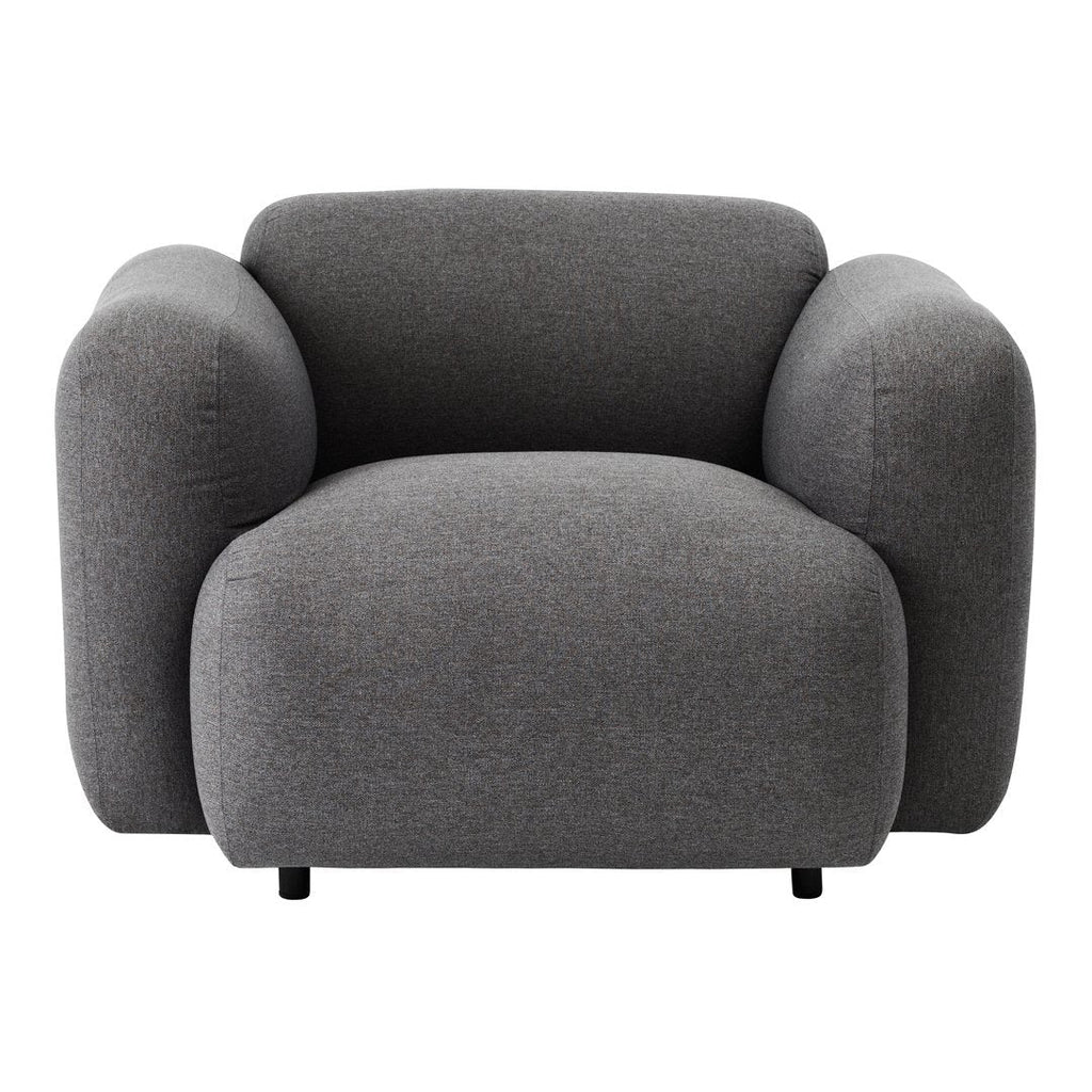 Fauteuil de salon rembourré minimaliste avec silhouette aux courbes douces pour le salon