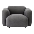 Fauteuil de salon rembourré minimaliste avec silhouette aux courbes douces pour le salon
