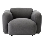 Fauteuil de salon rembourré minimaliste avec silhouette aux courbes douces pour le salon