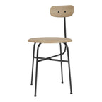 Chaise d'appoint minimaliste Bauhaus en acier et bois avec assise arrondie et dossier flexible pour salle à manger