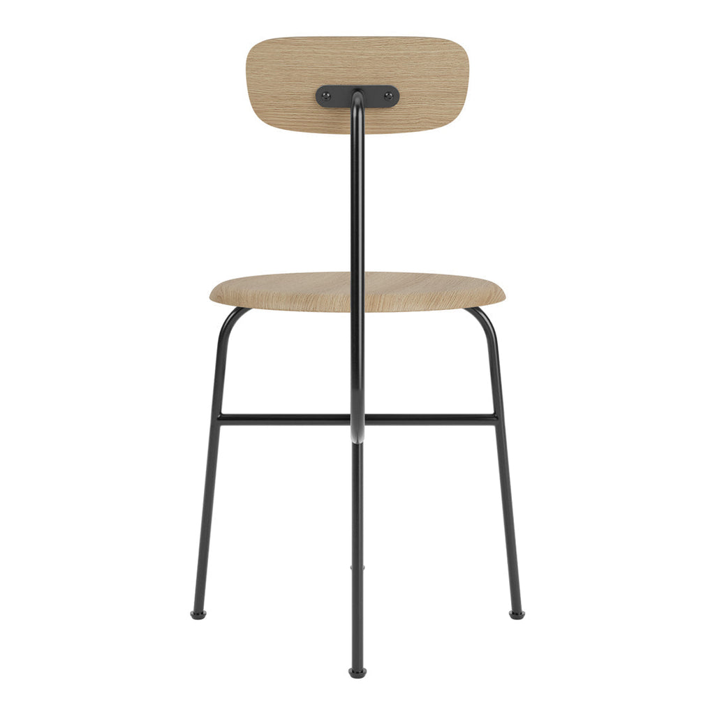 Chaise d'appoint minimaliste Bauhaus en acier et bois avec assise arrondie et dossier flexible pour salle à manger