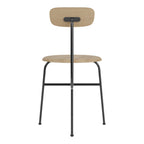 Chaise d'appoint minimaliste Bauhaus en acier et bois avec assise arrondie et dossier flexible pour salle à manger