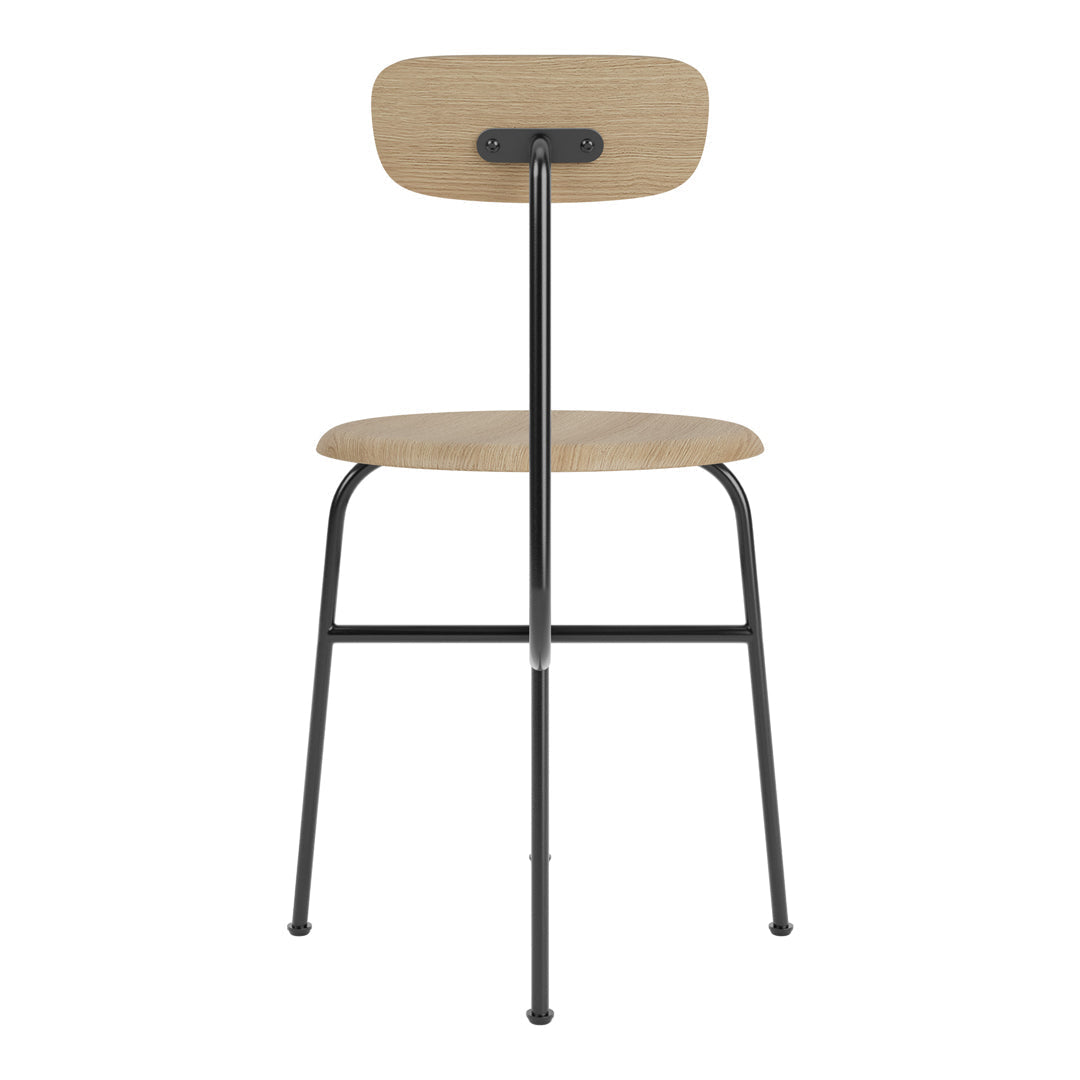 Chaise d'appoint minimaliste Bauhaus en acier et bois avec assise arrondie et dossier flexible pour salle à manger
