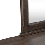 Lit rembourré marron, commode avec miroir et table de chevet