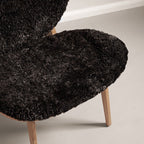Fauteuil de salon scandinave en chêne massif avec dossier incurvé en forme d'oreille d'éléphant pour salon