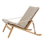 Fauteuil de salon scandinave en chêne massif et toile de lin avec dossier pliable et ferrures en laiton pour salon