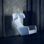 Fauteuil lounge ailé moderne rembourré avec silhouette dynamique arrondie pour salon
