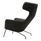 Fauteuil lounge ailé moderne rembourré avec silhouette dynamique arrondie pour salon