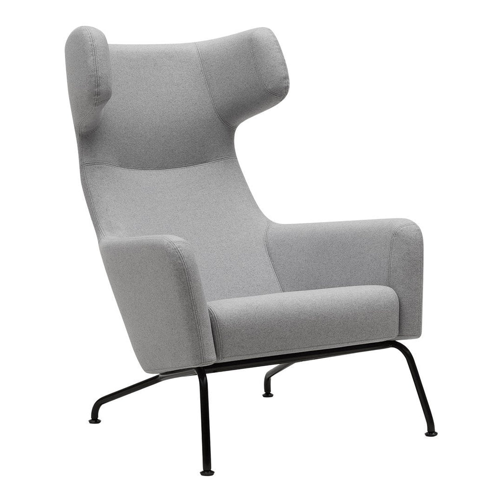 Fauteuil lounge ailé moderne rembourré avec silhouette dynamique arrondie pour salon