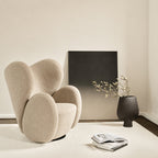 Fauteuil de salon pivotant entièrement rembourré Art Déco avec structure bloc volumineuse pour salon