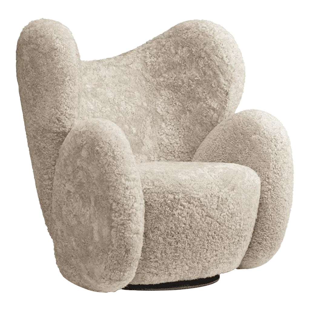 Fauteuil de salon pivotant entièrement rembourré Art Déco avec structure bloc volumineuse pour salon