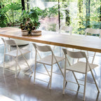 Chaise d'appoint pliante compacte en polypropylène et acier avec une largeur pliée ultra-fine de 2 cm pour la salle à manger
